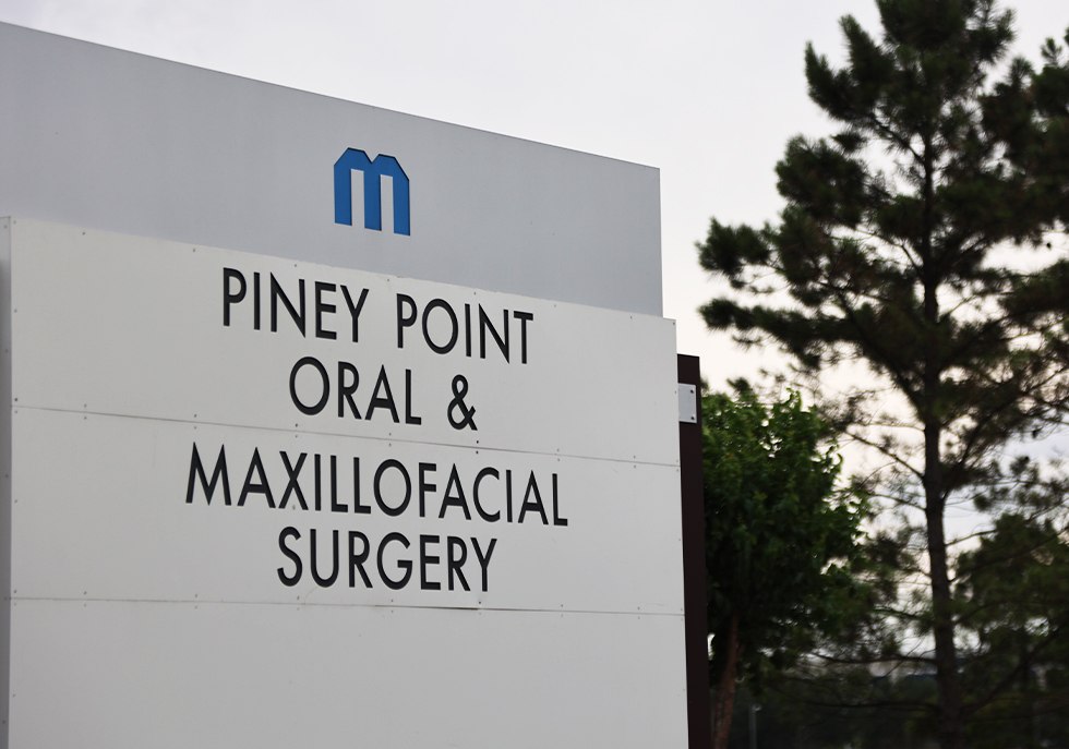 Piney Point Oral and Maxillofacial Surgery sign by the road outside Katy/Cypress oral surgery office