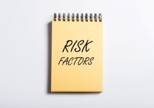 “Risk Factors” written on simple notepad